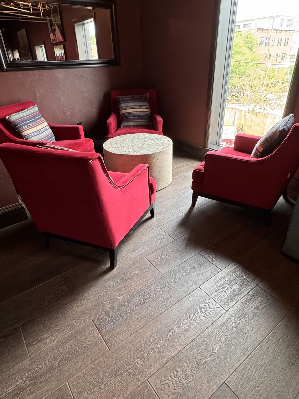 Lounge area with a bar sofas guests and TVs